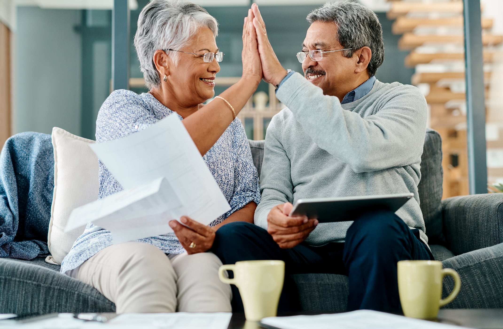 Pennsylvania Gold IRA Investing Company getty couple high five happy